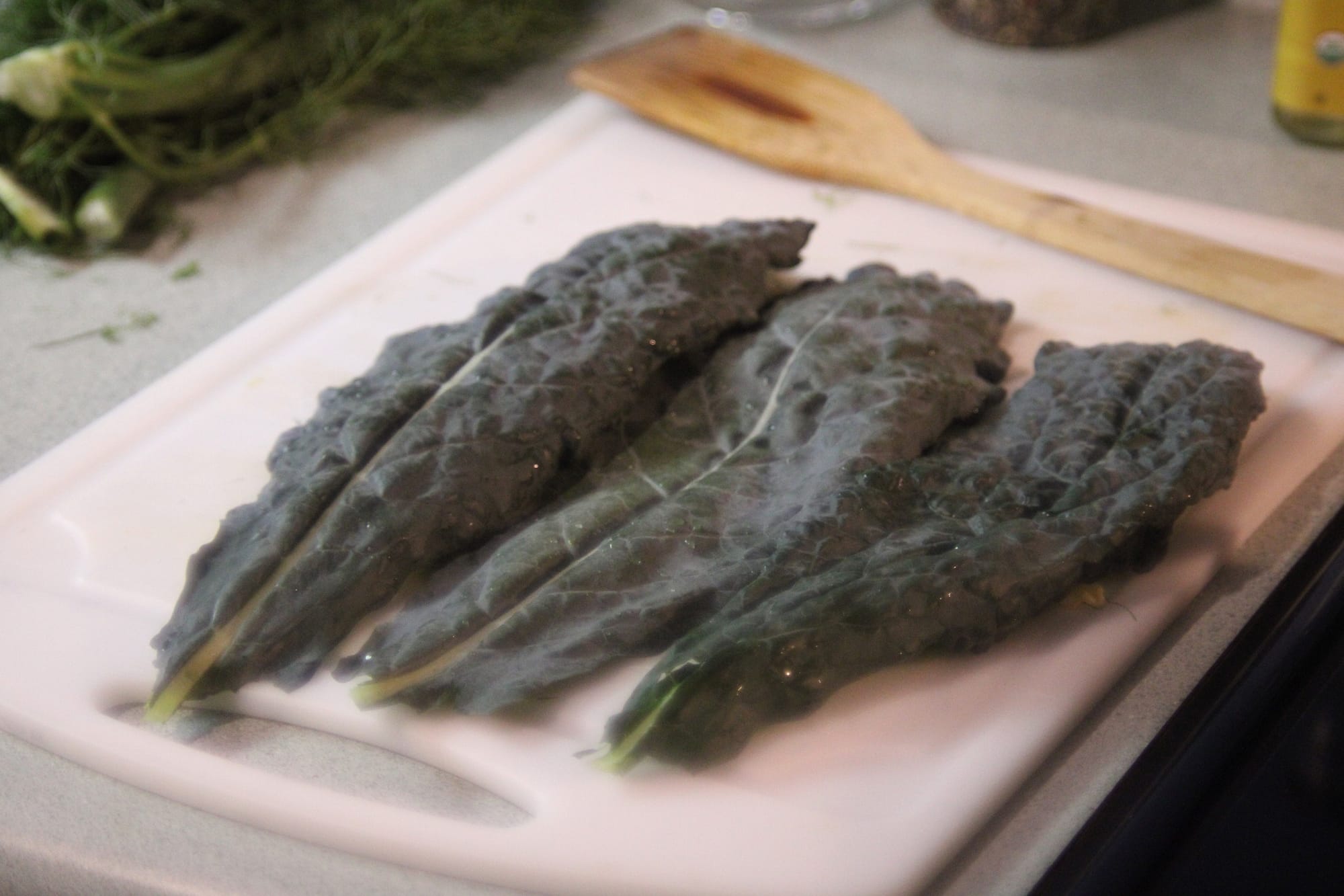 Kale on the cutting board.