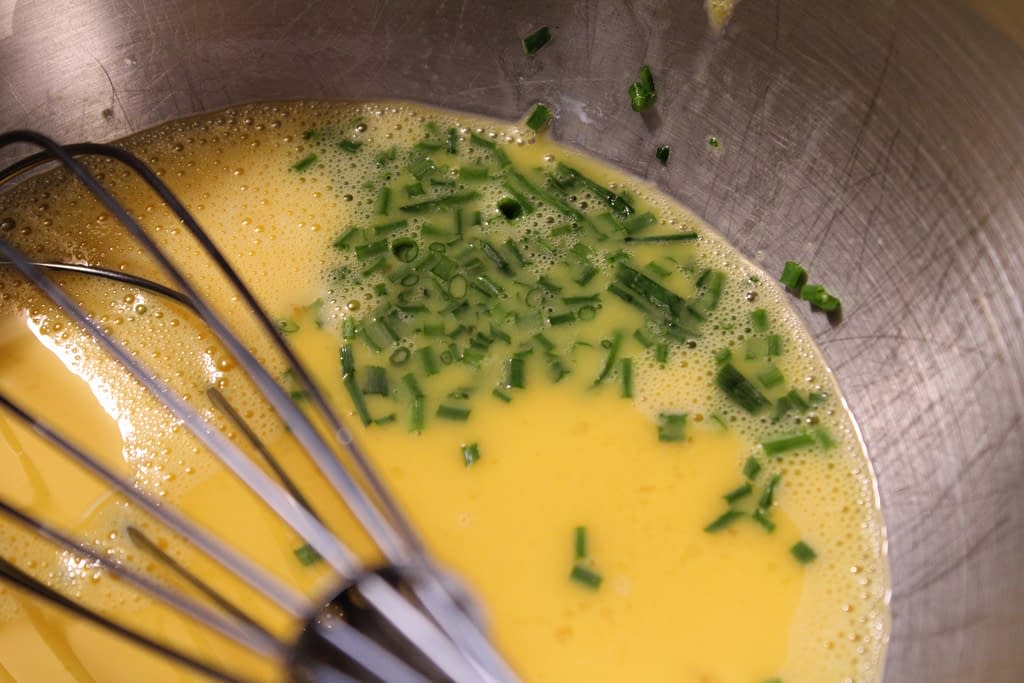 Chives in whisked eggs.