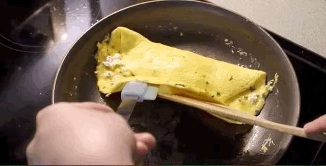 Folding other third of the omelette.