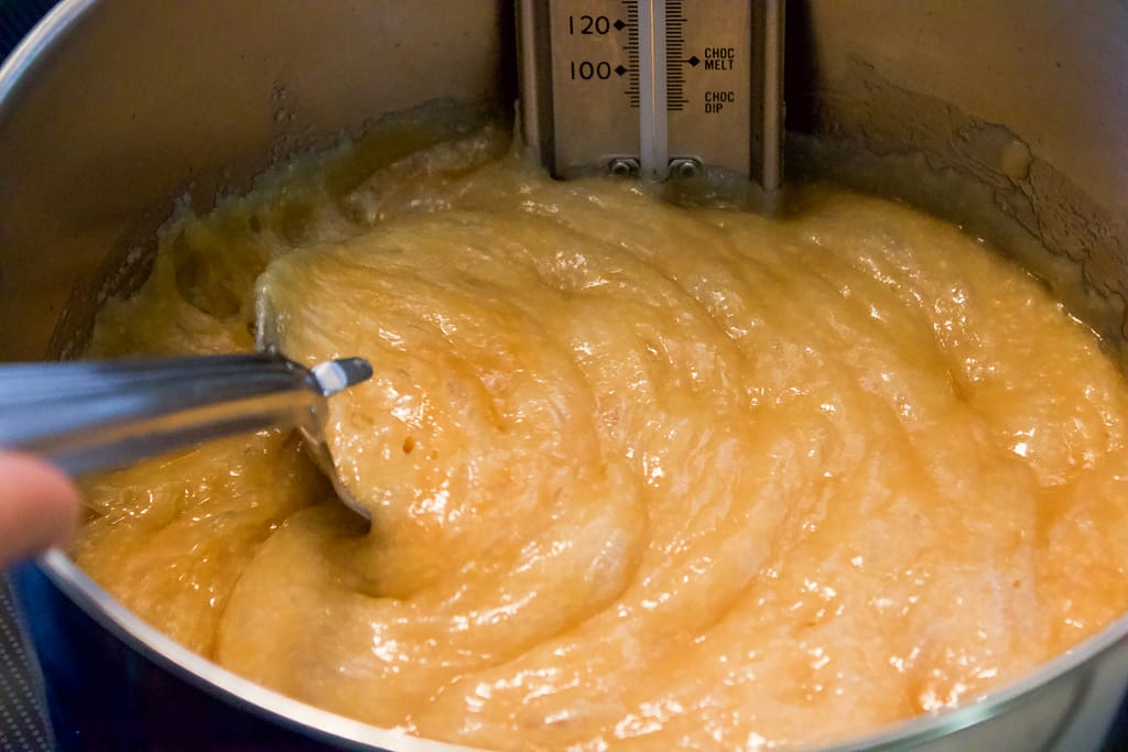 Sugar and butter syrup boiling in a pan.