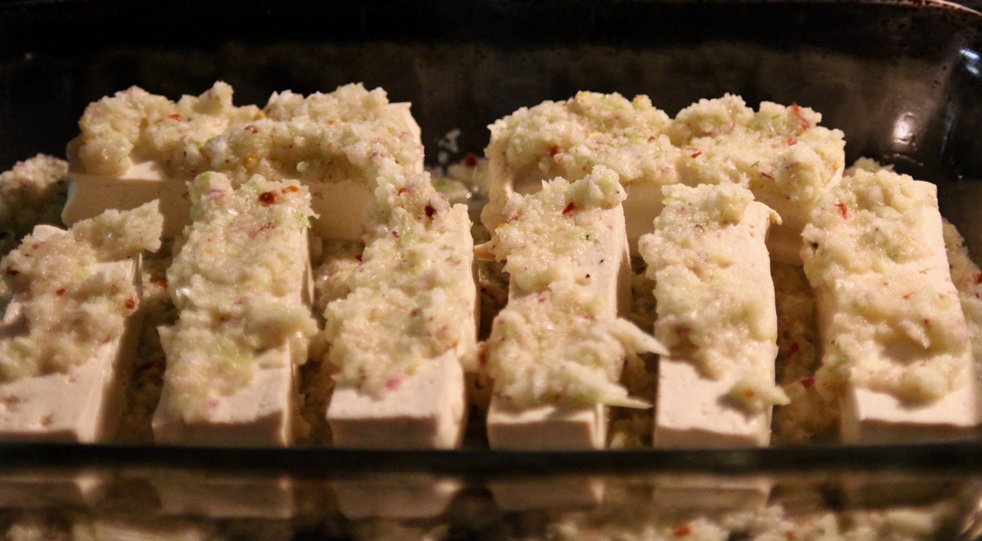 Tofu with onion and fennel mixture about to go into the oven.