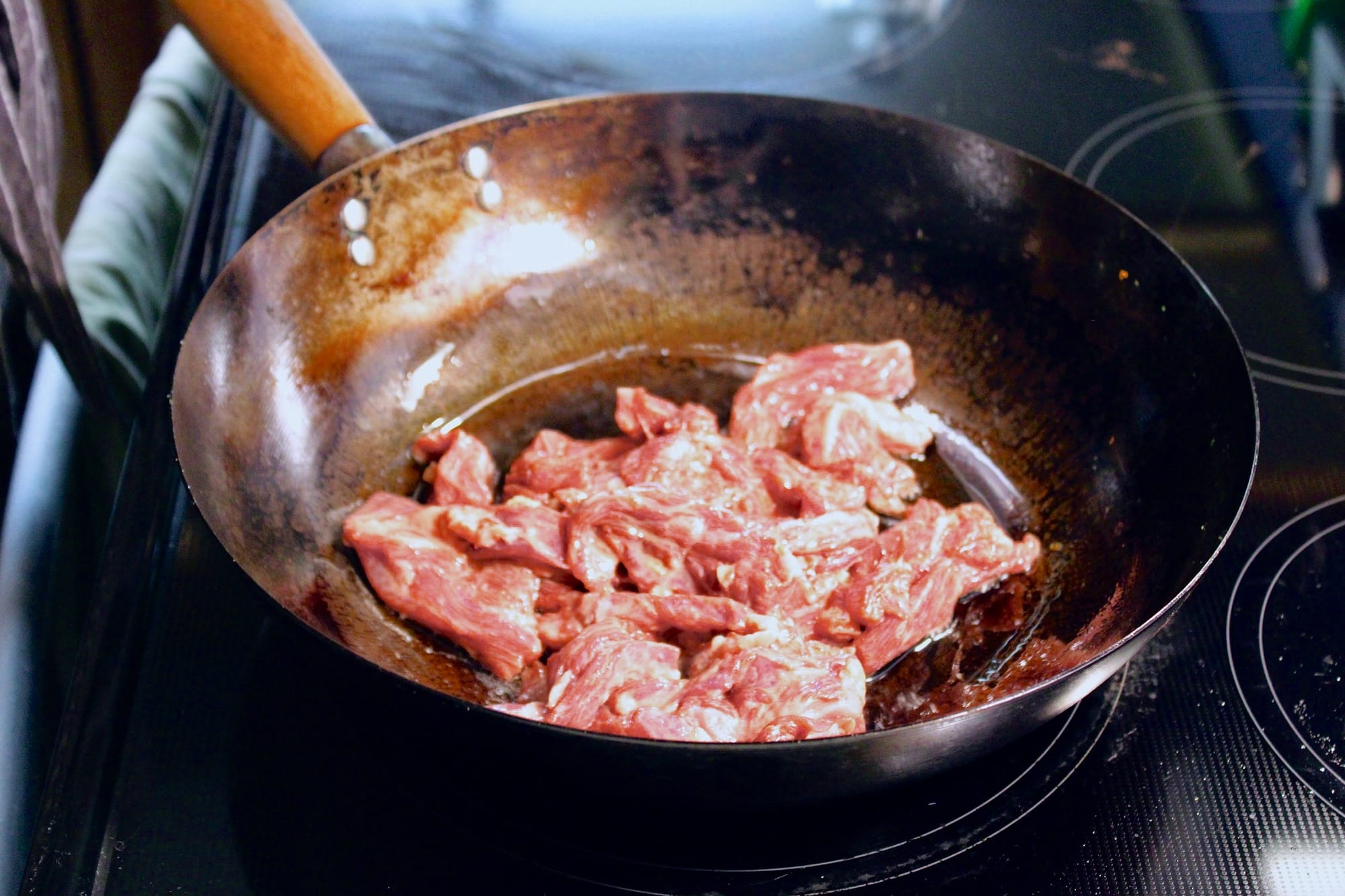 Cooking beef in a wok.