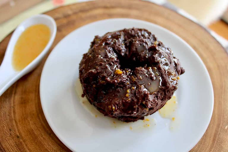 Chocolate glazed donuts with orange glaze.